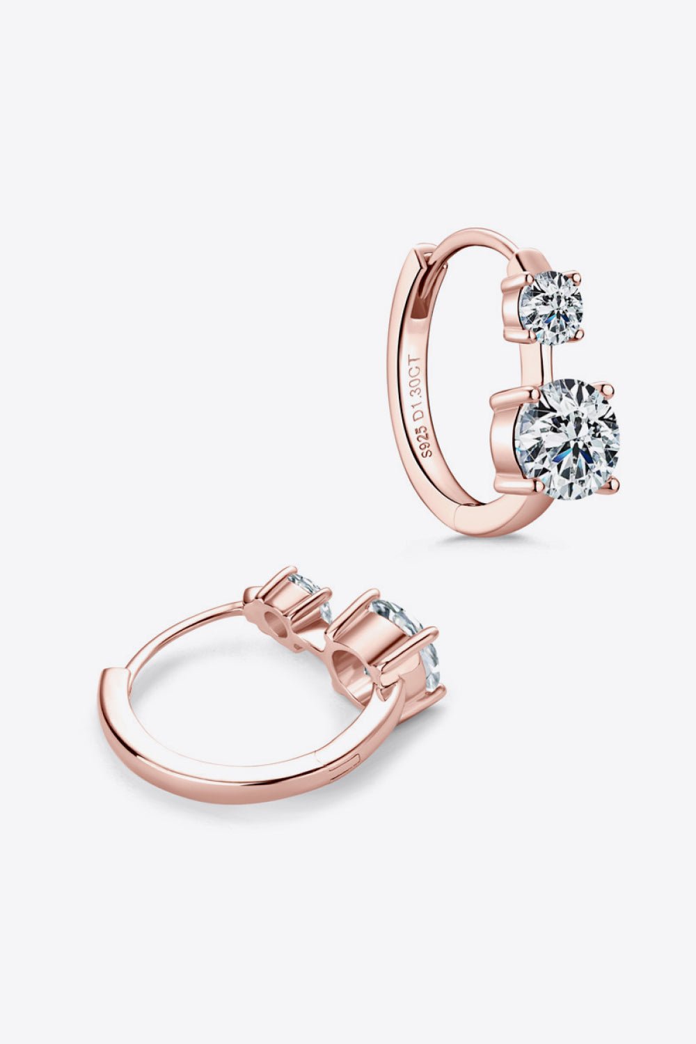 Elegant rose gold 1.3 carat moissanite hoop earrings with sparkling stones, showcased on a plain background.