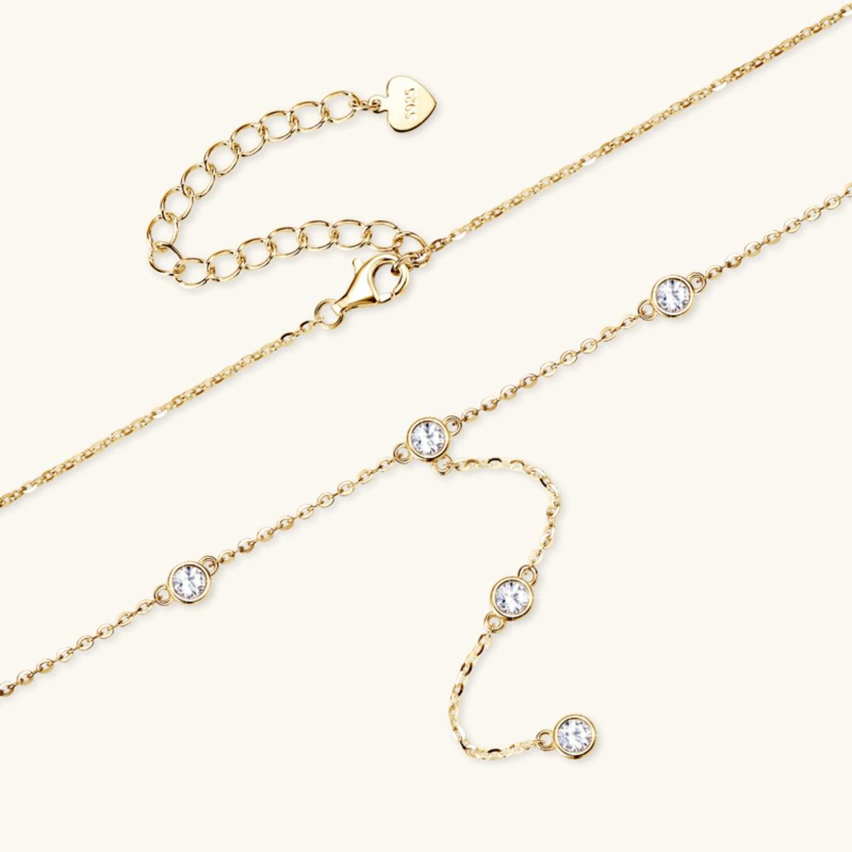 Elegant gold-tone necklace with delicate chain and sparkling cubic zirconia accents