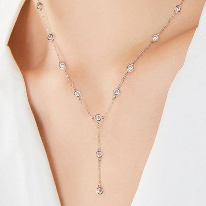 Elegant sterling silver necklace with sparkling moissanite stones cascading down the chain, creating a beautiful, feminine accessory.