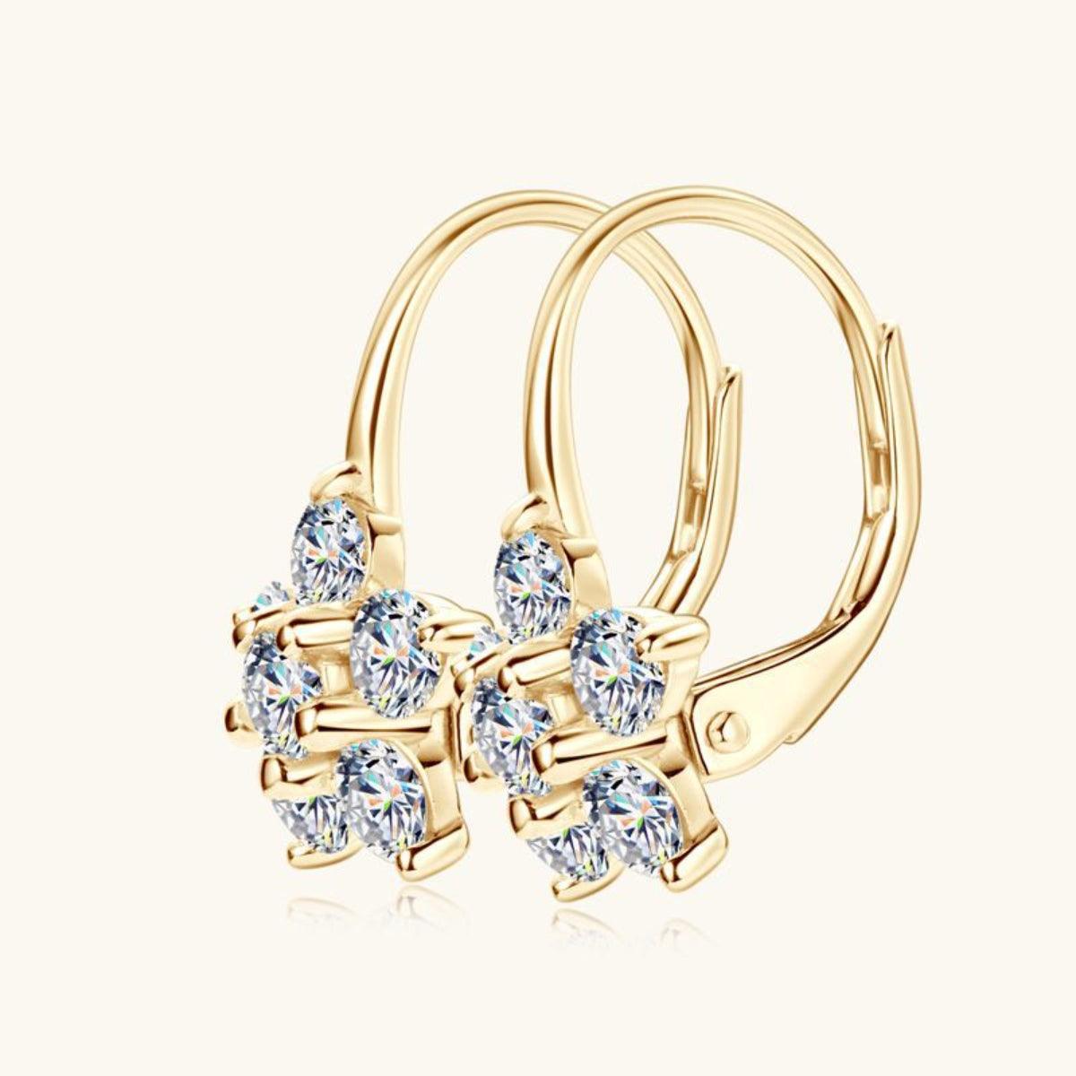 Elegant gold-tone sterling silver earrings with sparkling moissanite flower accents. Stylish and versatile huggie hoop design.