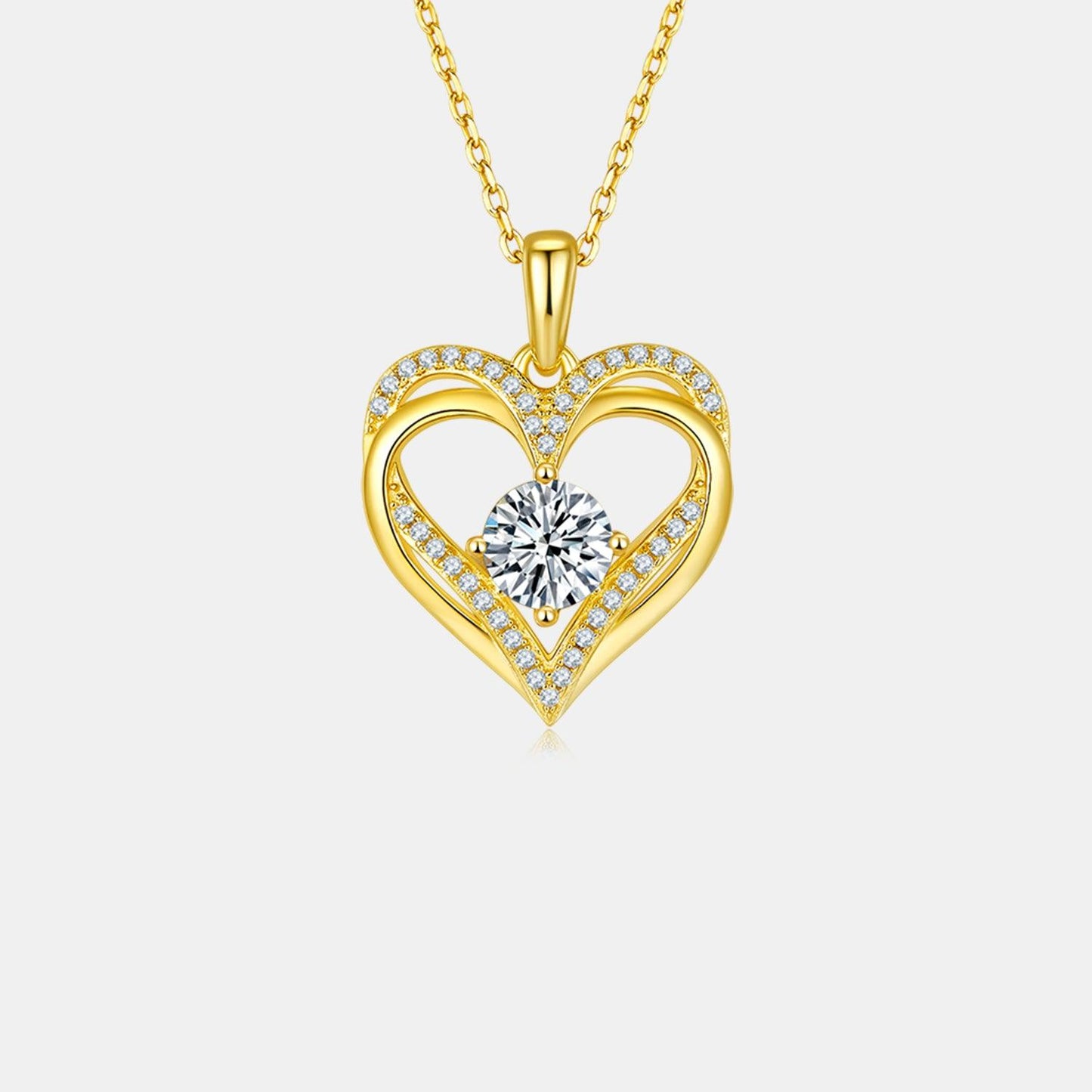 Elegant heart-shaped pendant with a sparkling center stone, adorned with shimmering crystals on a slender golden chain