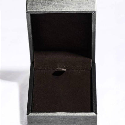 Sleek black jewelry box with textured silver exterior, displaying an elegant design for a premium jewelry item.