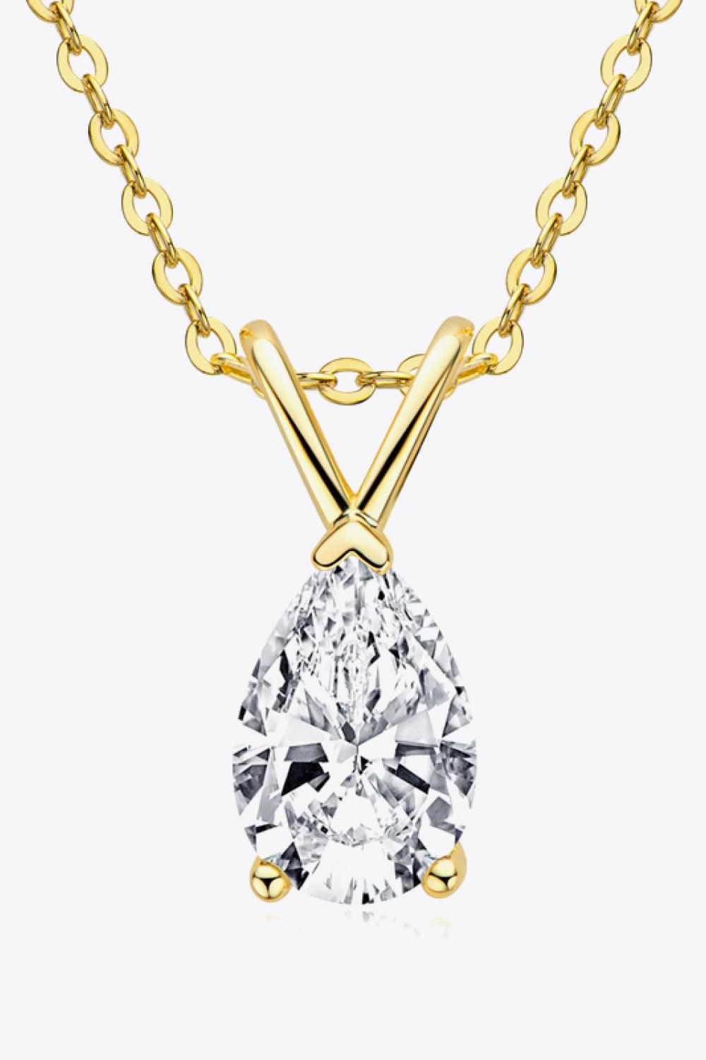 Elegant gold chain necklace with sparkling pear-shaped diamond pendant in the center