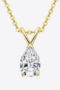 Elegant gold chain necklace with sparkling pear-shaped diamond pendant in the center