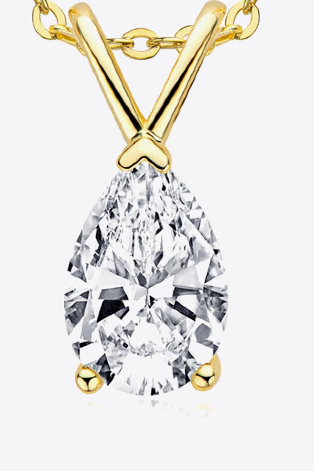 Sparkling pear-shaped diamond pendant necklace in 925 sterling silver with a golden chain, showcasing the elegant craftsmanship and brilliant gemstone.