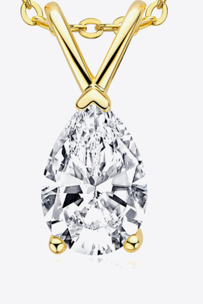 Sparkling pear-shaped diamond pendant necklace in 925 sterling silver with a golden chain, showcasing the elegant craftsmanship and brilliant gemstone.