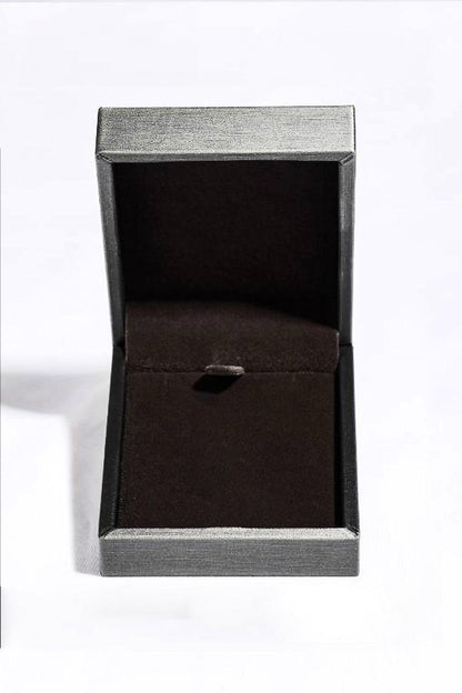 Elegantly designed gray jewelry box showcasing a 1.5 Carat Moissanite Pendant 925 Sterling Silver Necklace from Trendsi, a high-quality fashion accessory.