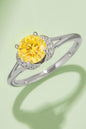 1 carat moissanite round-cut yellow stone in 4-prong 925 sterling silver ring with diamond accents