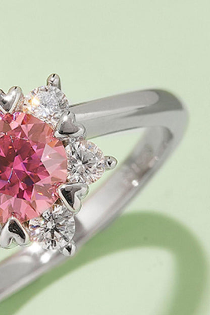 Elegant sterling silver ring with pink moissanite center and diamond accents