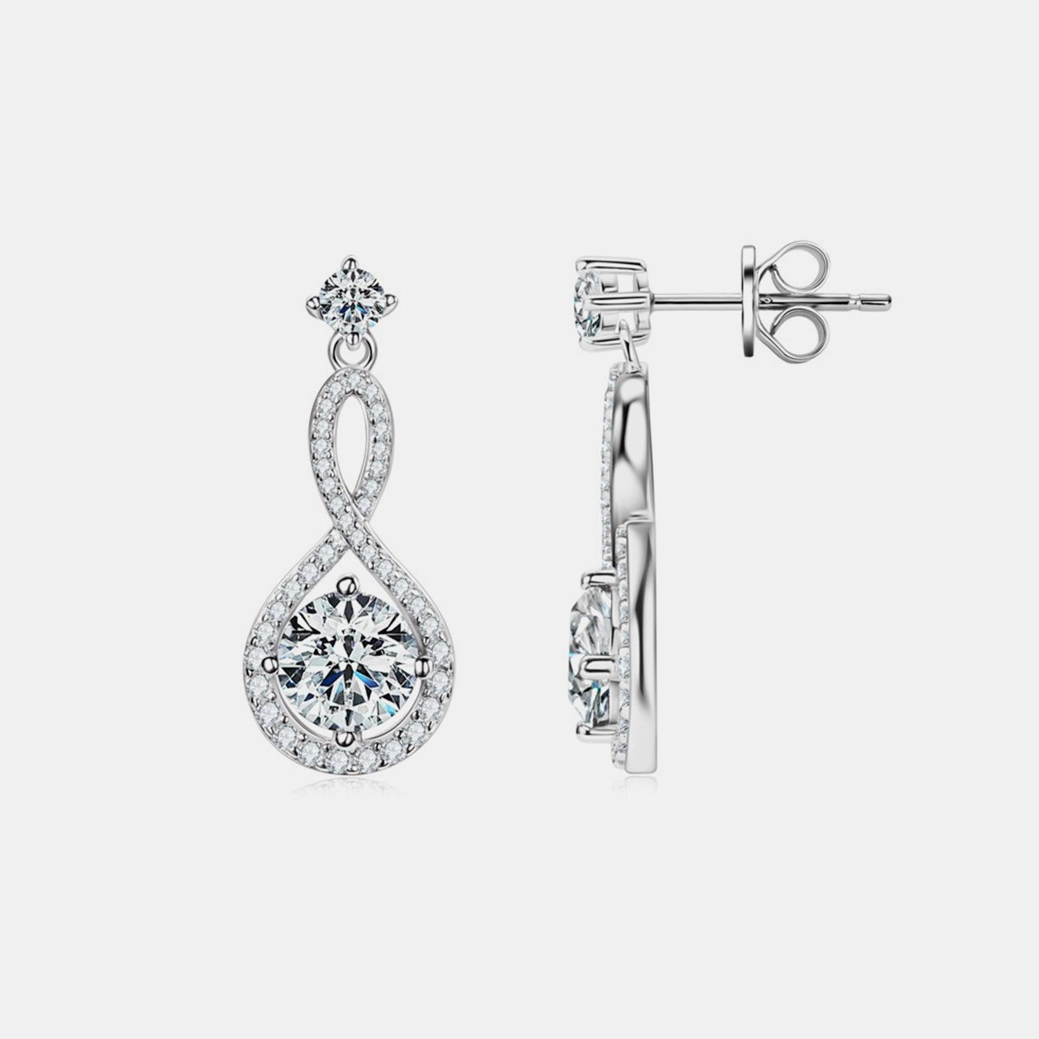 Elegant sterling silver earrings featuring a round moissanite center stone surrounded by a sparkling halo of smaller stones, creating a dazzling drop design.