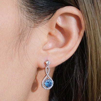 Elegant 1 carat moissanite 925 sterling silver earrings with blue gem accents