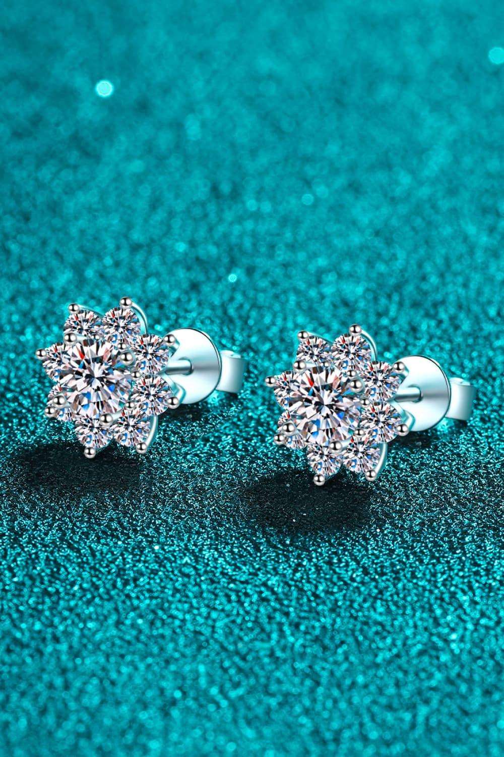 Elegant Diamond Flower Earrings on Turquoise Background