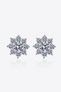 Elegant flower-shaped sterling silver earrings featuring sparkling moissanite gemstones.