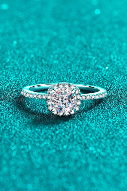 Sparkling diamond engagement ring on turquoise background