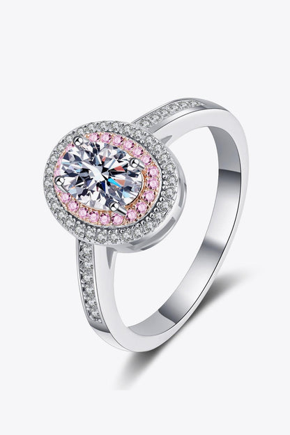 Elegant sterling silver ring with sparkling moissanite center stone surrounded by a pink and white gemstone halo design.