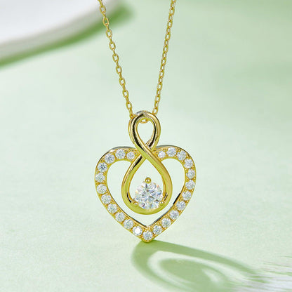 Sparkling Heart-Shaped Moissanite Necklace - Elegant 925 Sterling Silver Pendant with Glistening Cubic Zirconia Accents, Displayed on a Delicate Gold Chain.