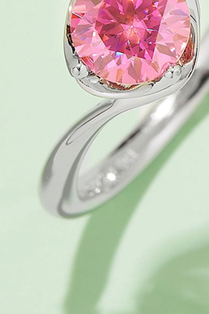 Vibrant pink moissanite solitaire ring in sleek sterling silver setting