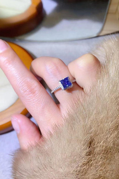 Elegant square-cut sapphire ring on woman's finger