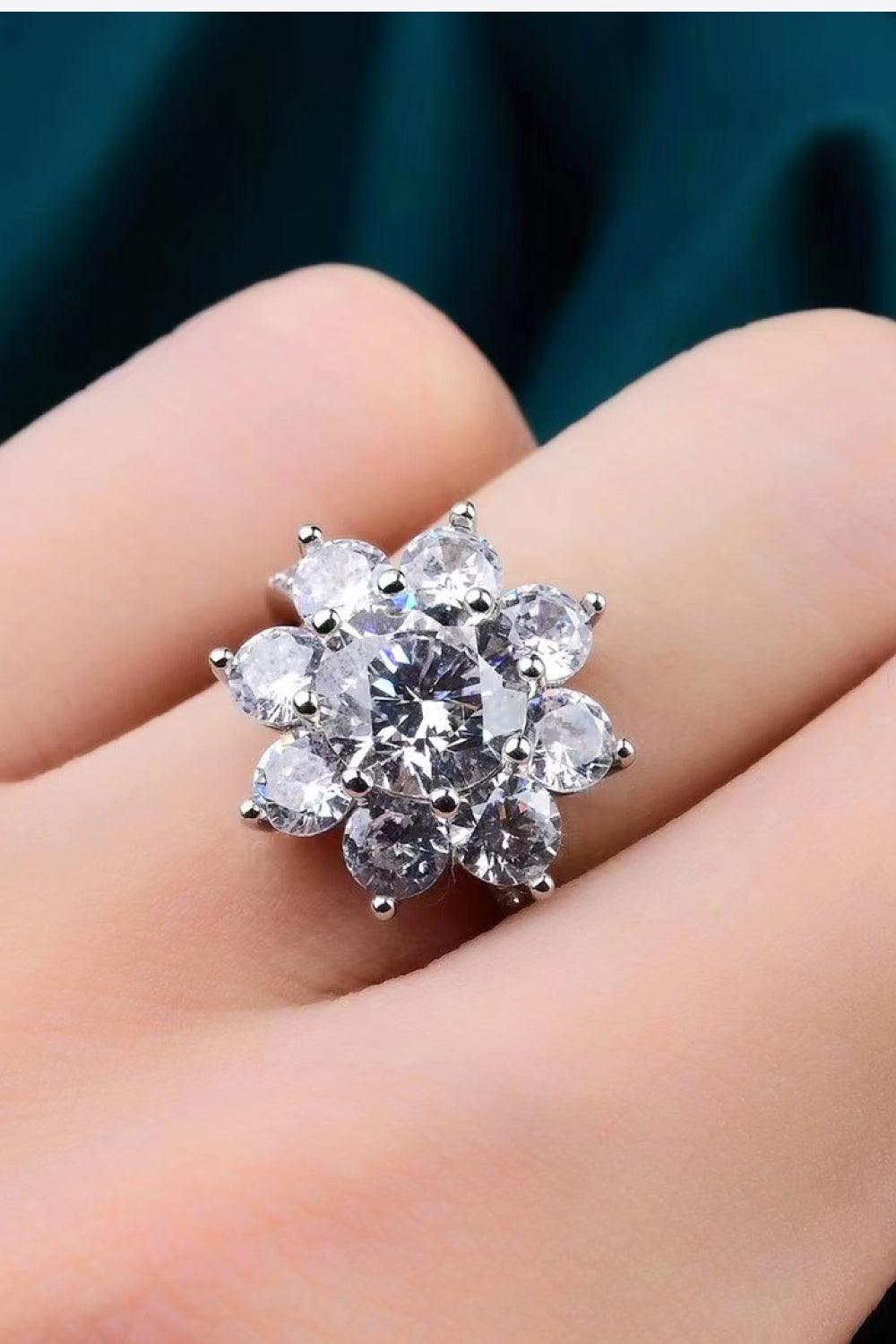 Sparkling 1 Carat Moissanite Flower Ring on hand