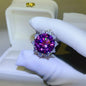 Stunning 10-carat Moissanite 925 sterling silver flower-shaped ring with vivid purple hue and sparkling crystal accents, showcased in a white gift box.