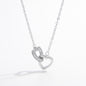 a silver necklace with a heart on it