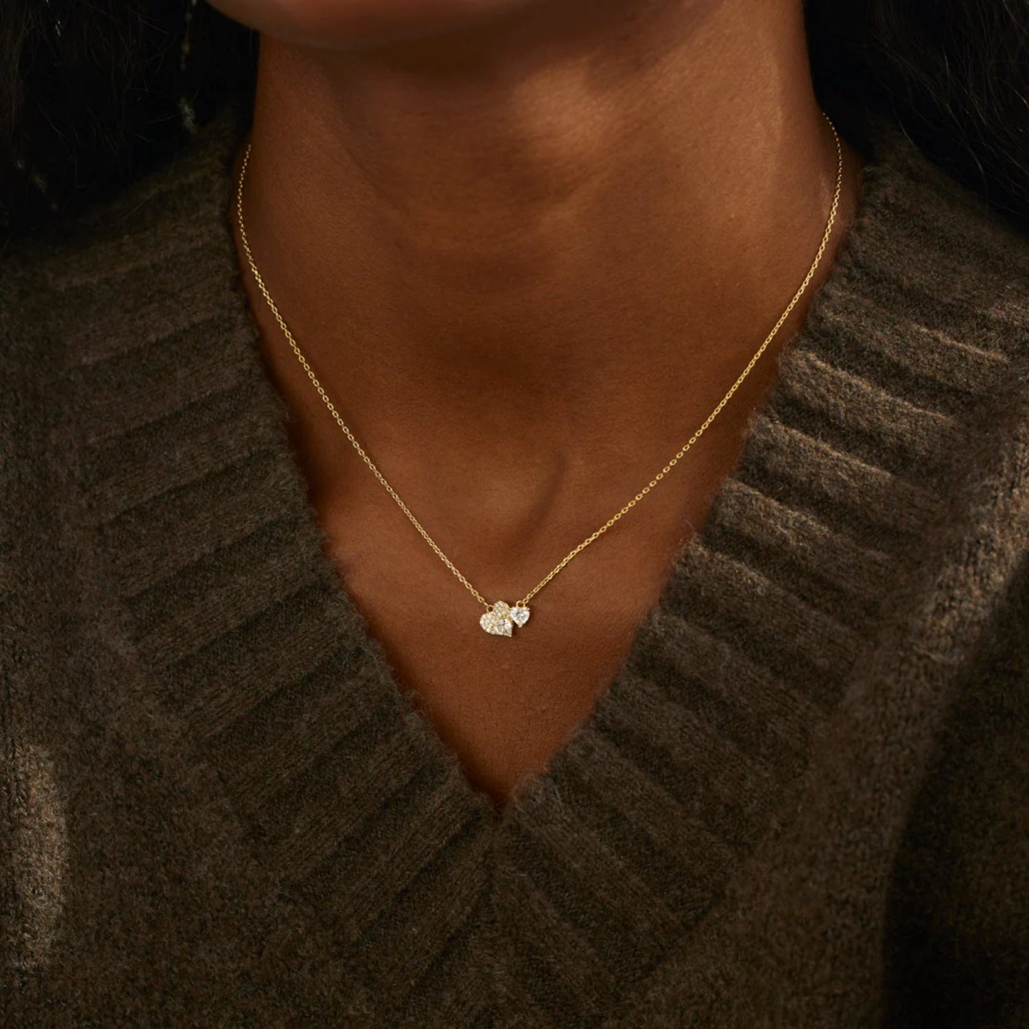 a close up of a person wearing a necklace