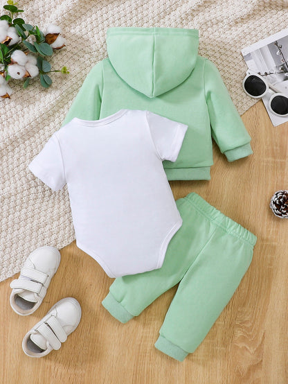 a baby boy's green and white outfit and shoes