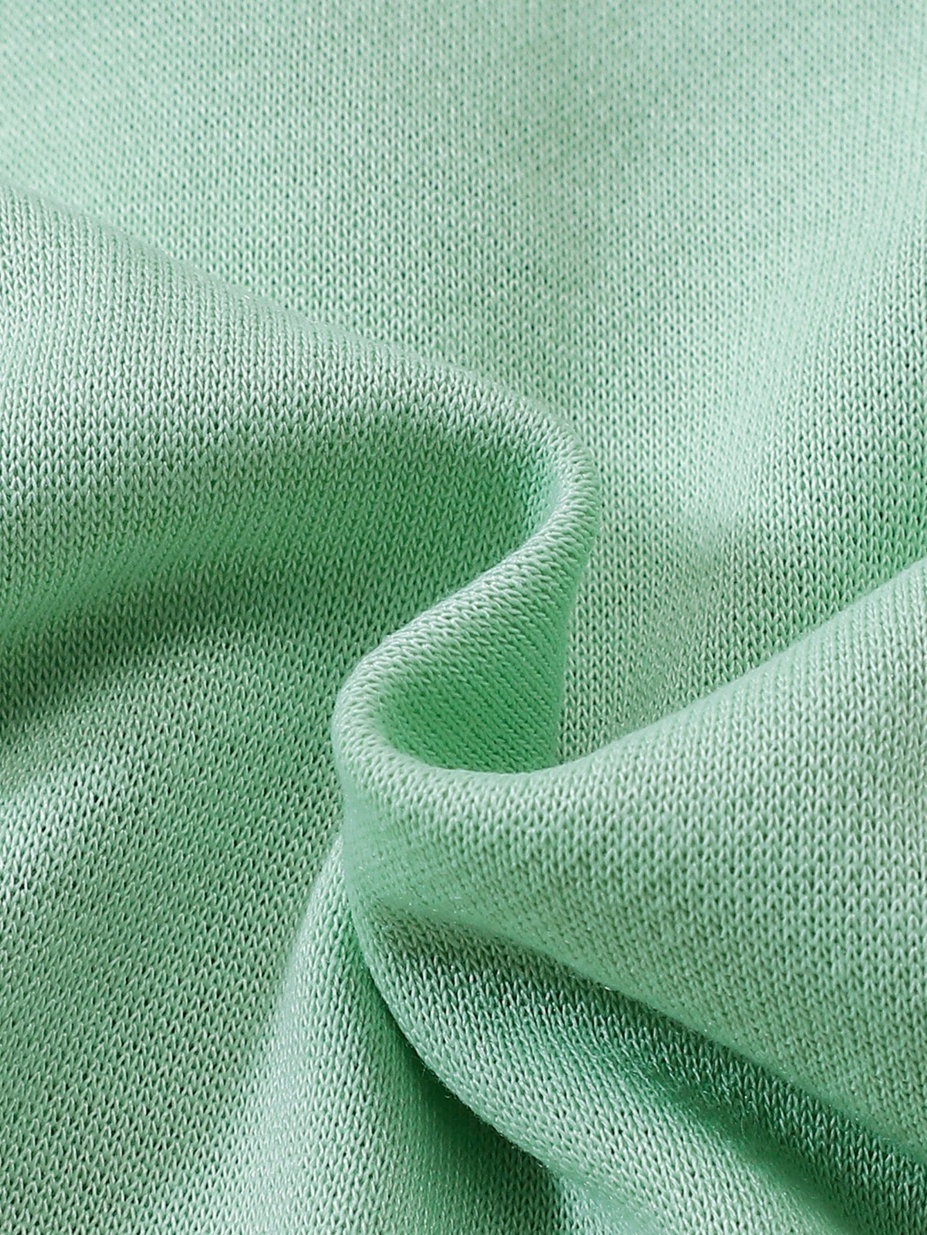 a close up view of a green fabric