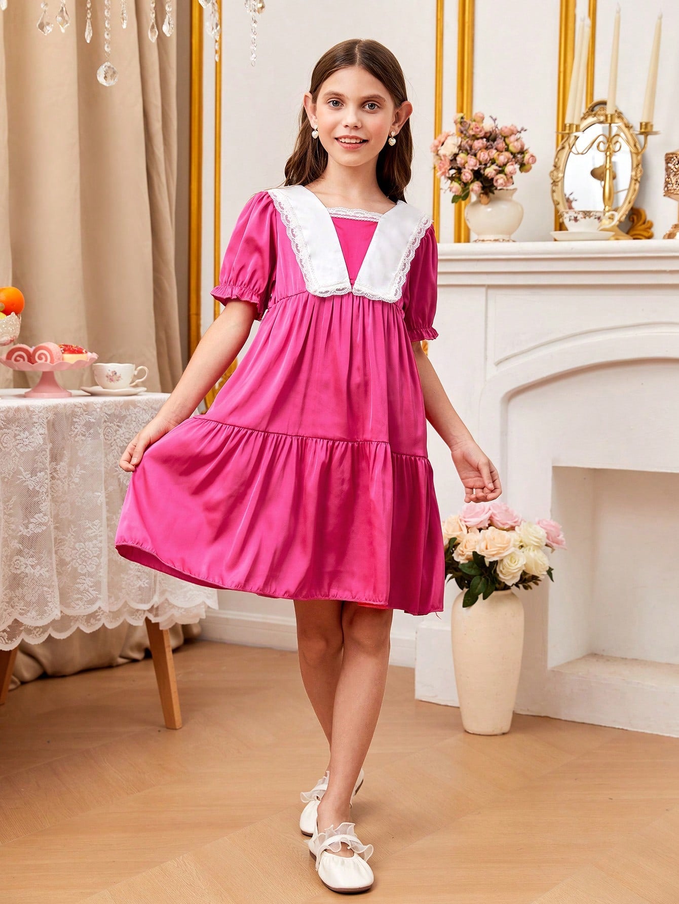 a young girl in a pink dress holding a bouquet of flowers