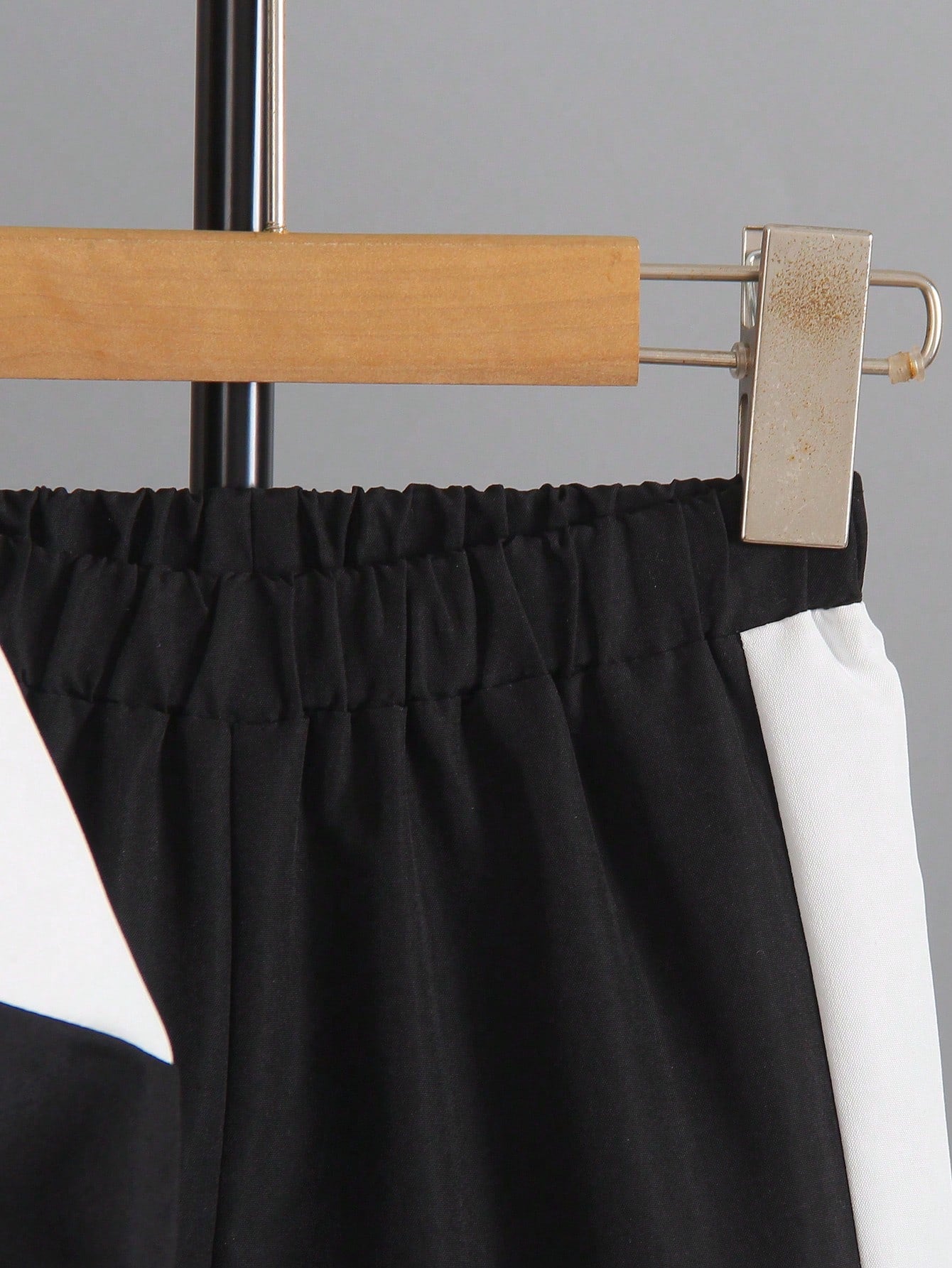 a close up of a pair of pants hanging on a clothes rack