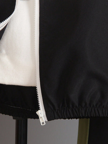 a black and white jacket with a white zipper