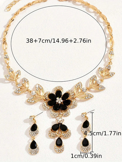 a black and white flower necklace and earring set