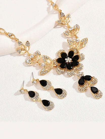 a pair of black and white flower earrings