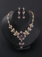 a necklace and earring set with purple stones