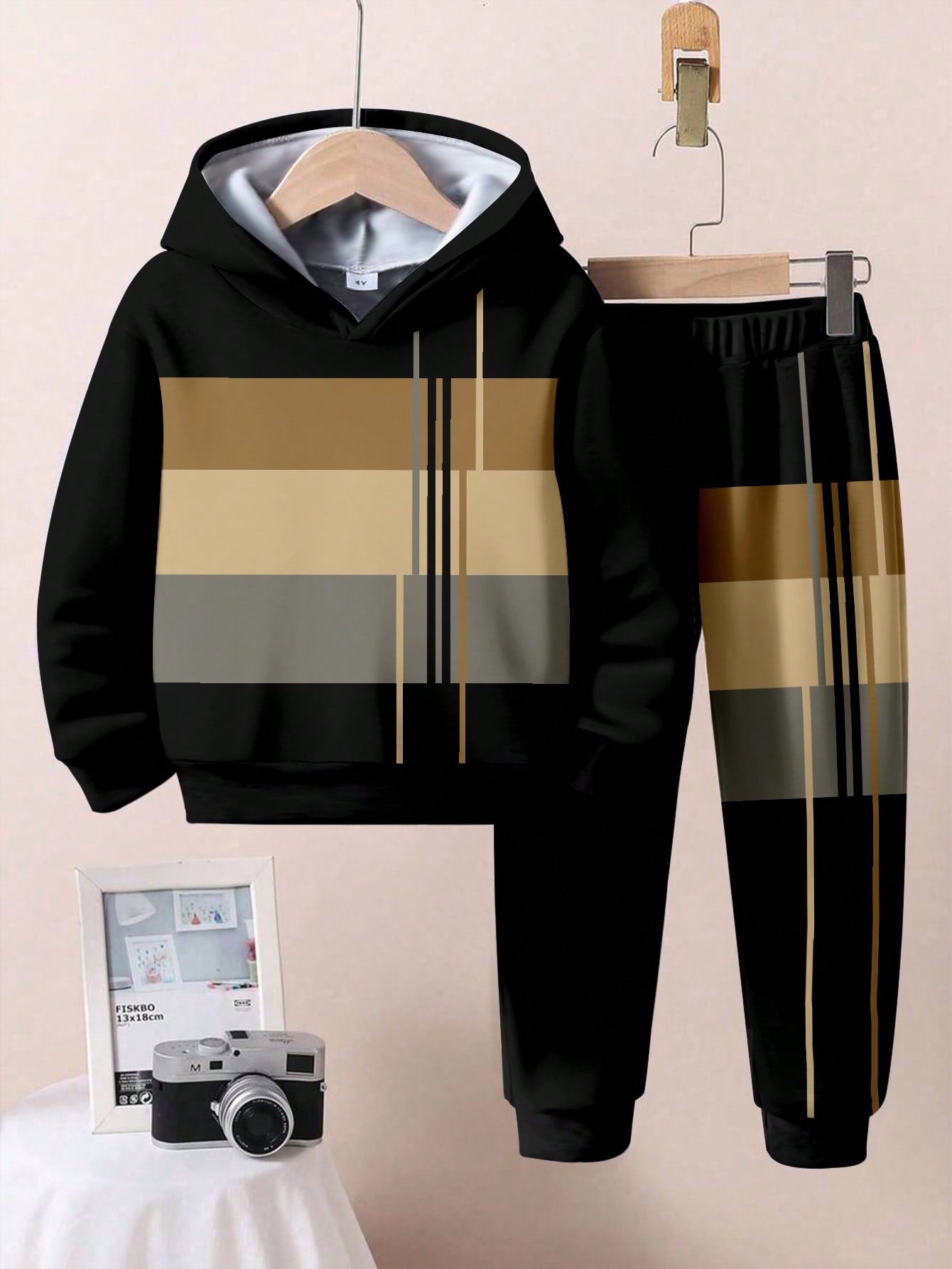 a black and gold striped hoodie and pants