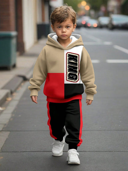 a young boy is walking down the street