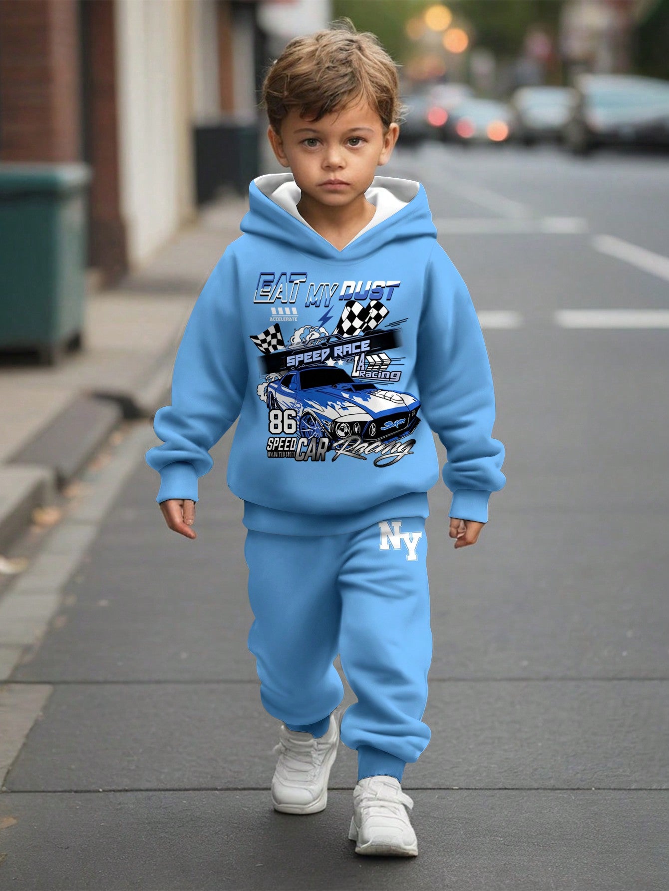 a young boy is walking down the street