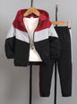 a red, white and black jacket and black pants