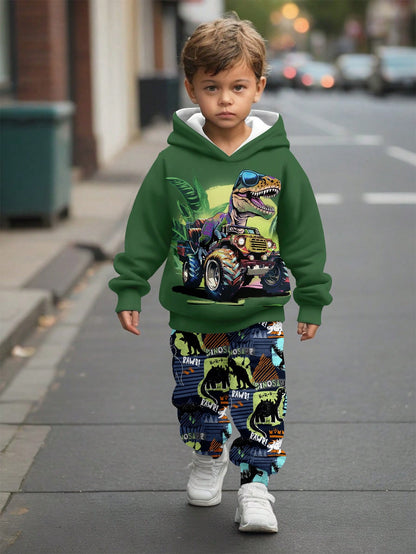 a young boy walking down a street wearing a green hoodie