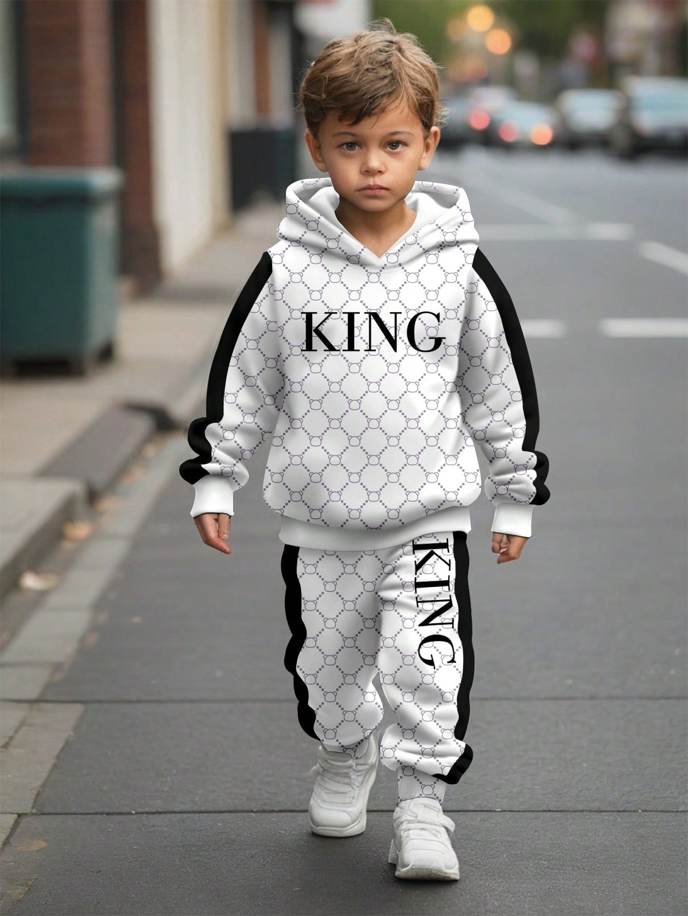 a young boy is walking down the street