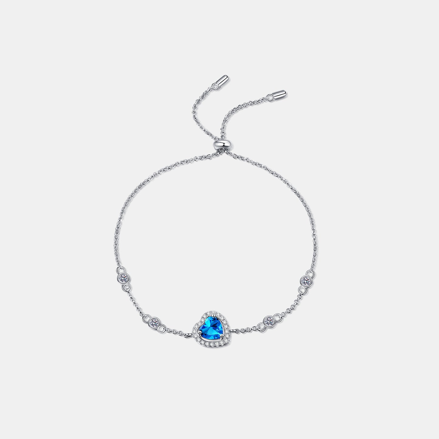 Elegant sterling silver bracelet with sparkling blue gemstone and floral accents