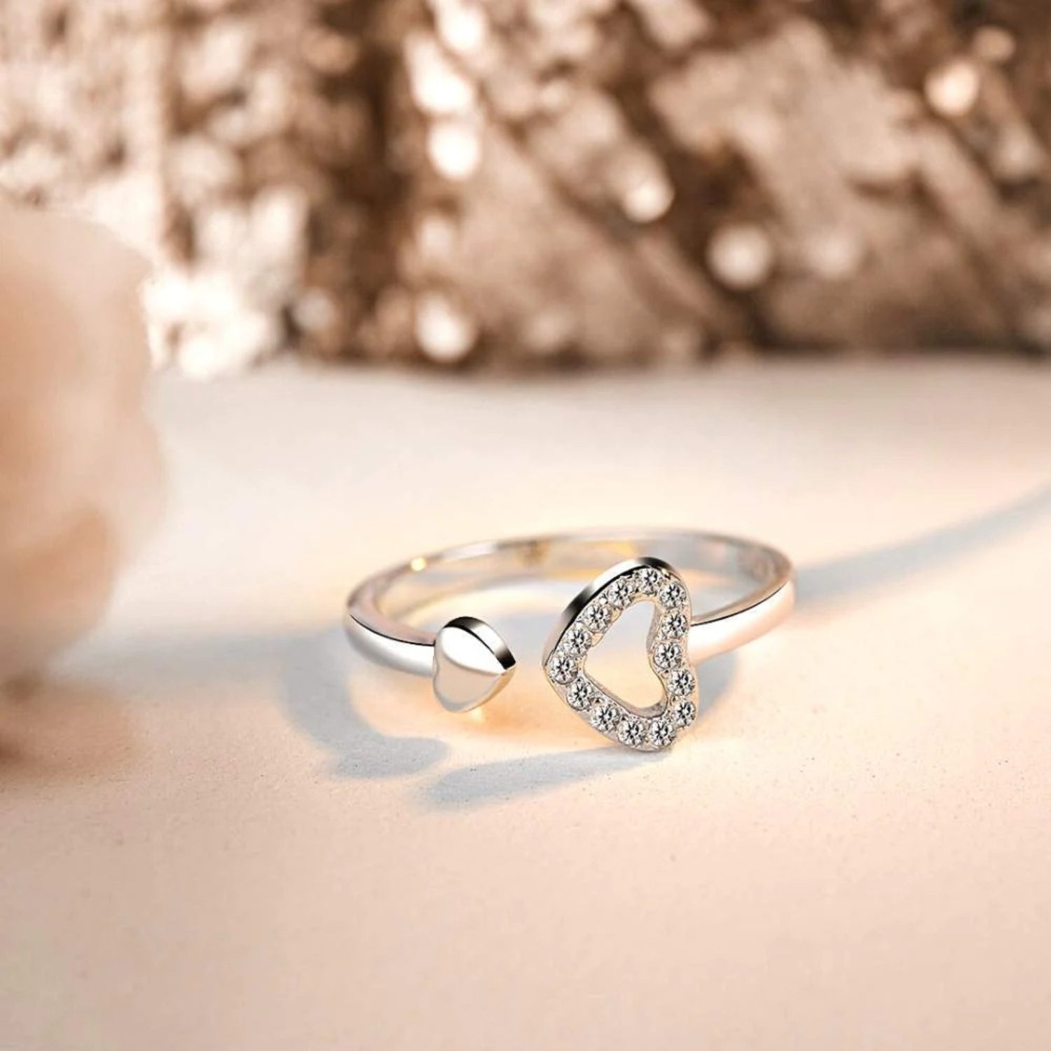 a white gold ring with a diamond heart