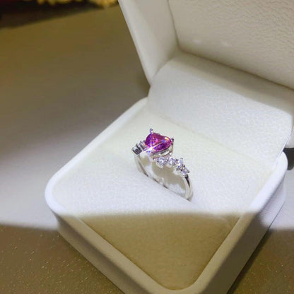 Elegant 1 Carat Moissanite 925 Sterling Silver Ring with Sparkling Pink Gemstone and Surrounding Diamonds on a White Gift Box