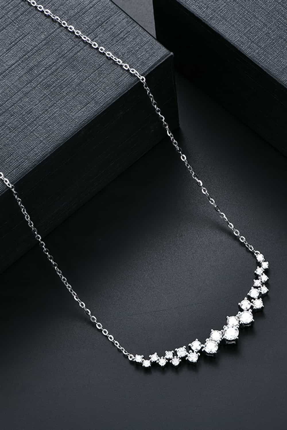 Elegant 1.64 Carat Moissanite 925 Sterling Silver Necklace on a dark modern background