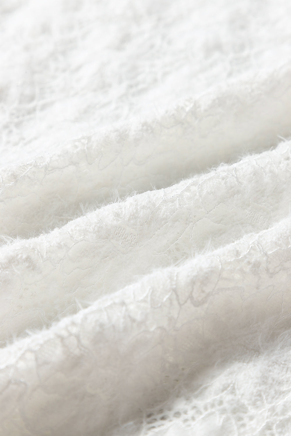 a close up of a white fabric with a pattern