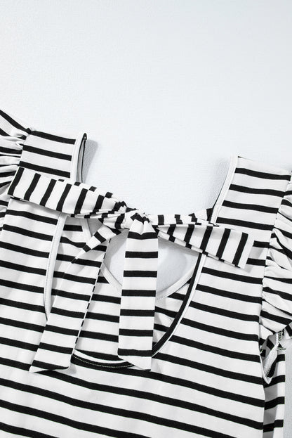 a black and white striped shirt with ruffles