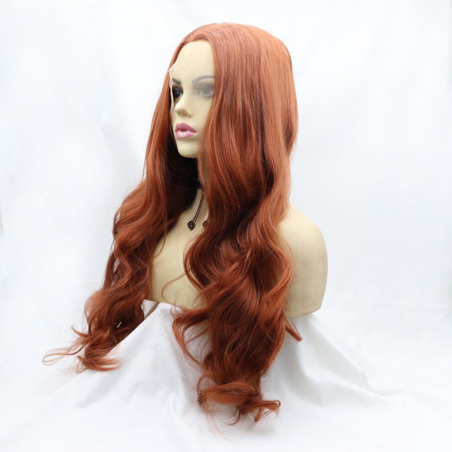 Long, wavy synthetic wig with vibrant auburn color and 130% density.