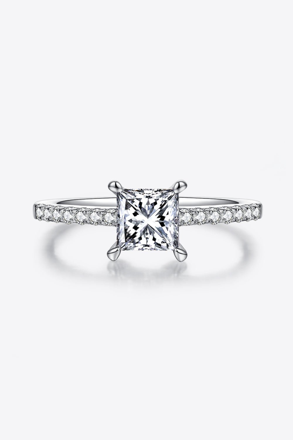 Elegant 1.21 carat moissanite solitaire ring with sterling silver band adorned with sparkling side stones