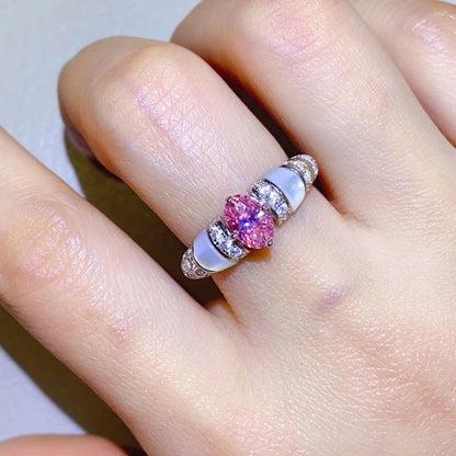 Elegant 1 carat moissanite silver ring with stunning pink gemstone and sparkling accents on finger