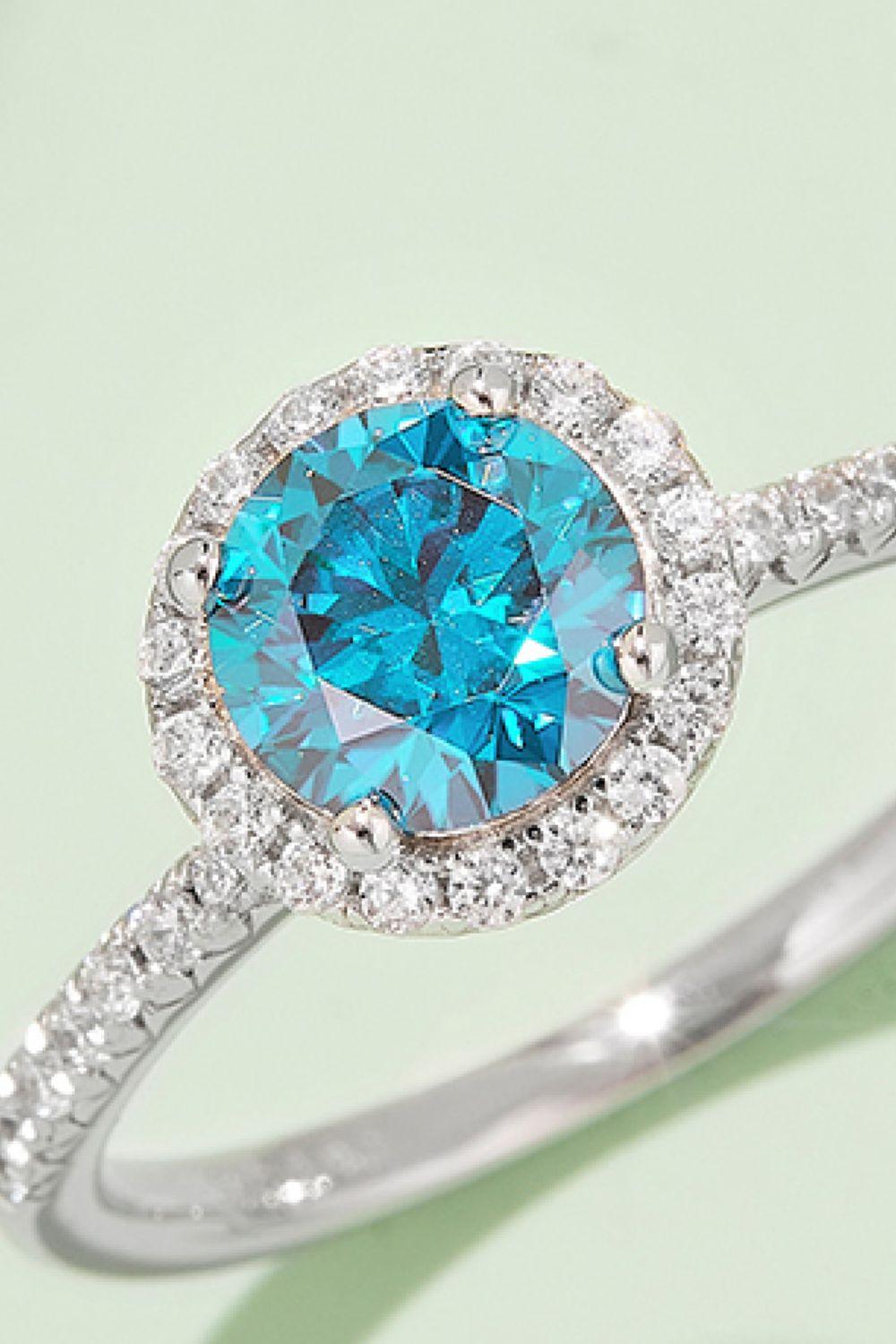 Stunning 1 Carat Moissanite Ring with Brilliant Turquoise Center Stone and Sparkling Silver Band